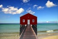 A red house on the water. Royalty Free Stock Photo