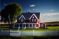 a red house with a white picket fence in front of it and a tree in the background with a blue sky Royalty Free Stock Photo