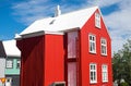 Red house with white roof