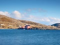 Red houses of the fishing village. Traditional red white building in small port, coastline of cold north sea Royalty Free Stock Photo