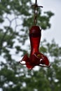 Red Hummingbird Feeder Hanging Down Waiting for Hummers
