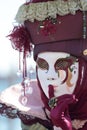 Red hushing mask at the Carnival of Venice