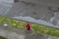 A red hydrant with long exposure rain pool in rainy day Royalty Free Stock Photo