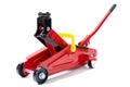 Red hydraulic floor jack isolated on white background