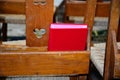 Red Hymn book on chair