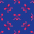 Red Ice hockey sticks and puck icon isolated seamless pattern on blue background. Game start. Vector Royalty Free Stock Photo