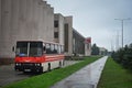 Red Ikarus bus at the parking near the Nalchik Hippodrome building