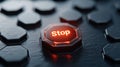 Red illuminated \'Stop\' button on dark hexagon surface Royalty Free Stock Photo