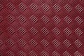 Red industrial plate with fishbone or diamond pattern Royalty Free Stock Photo