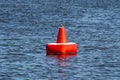 Red inflatable buoy on the blue sea Royalty Free Stock Photo