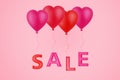 Red inflatable heart-shaped balloons on a pink background, with the inscription, Sale. Mothers Day. Valentine`s day