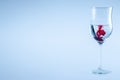 Red ink drop, wine glass with water. Half full glass wine isolated Royalty Free Stock Photo