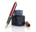 Red ink pen with a jar of ink Royalty Free Stock Photo