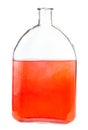 Red ink solution in water in glass flask isolated Royalty Free Stock Photo