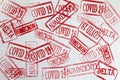 Red ink stamps covid19 and omicron delta lockdown closeup background Royalty Free Stock Photo