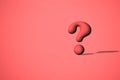 Red interrogation point. 3D render of a question mark, over a pale red background Royalty Free Stock Photo