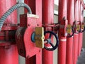 Red iron fire pipe and switch for water set line up in a long row. Royalty Free Stock Photo