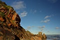 Red iron rich rocks showing off against the blue sky Royalty Free Stock Photo