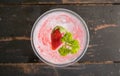 Red Italian Soda Cold Beverage and Strawberry Fruit and Parsley Flatlay Center Royalty Free Stock Photo