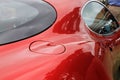 Red Alfa Romeo Italian sports car fuel door and window Royalty Free Stock Photo