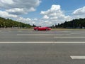 Red Jaguar E-Type car on street during retro-cruise Royalty Free Stock Photo