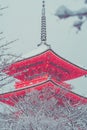 Red Japanese pagoda covered with white snow in Kiyomizu-dera Temple, Kyoto, Japan. Royalty Free Stock Photo