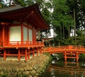 Red Japanese temple with bridge reflection Royalty Free Stock Photo