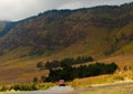 A red jeep is climbing the slopes of Mount Bromo. Royalty Free Stock Photo