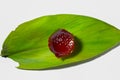 Red jelly on green leaves,render jelly on white background,jello small piece,green leaves red jello Royalty Free Stock Photo