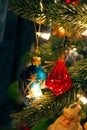 Red jewel Christmas ornament hanging among others on tree Royalty Free Stock Photo