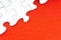 Red jigsaw puzzle pieces on red background. Royalty Free Stock Photo