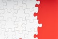 Red jigsaw puzzle pieces on red background. Royalty Free Stock Photo