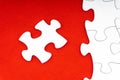 Red jigsaw puzzle pieces on red background. Royalty Free Stock Photo