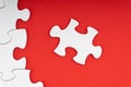 Red jigsaw puzzle pieces on red background. Royalty Free Stock Photo