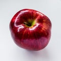 Red juicy apple on white photne, close-up, top view