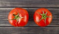 Red, juicy, fresh tomatoes on a wooden background Royalty Free Stock Photo