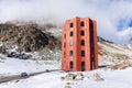 The red Julier Theater Tower on the Julier Pass (2284 m above sea level) in winter.