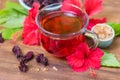 Red karkade hibiscus red sorrel tea in glass mug roselle flowers