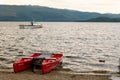 A red KataKanu boat at Loch Lomond lake in Scotland to be hired by tourists