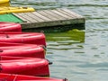 Red kayaks at the pier or dock on Mogosoaia lake, Romania Royalty Free Stock Photo