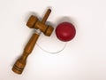 red kendama on white background