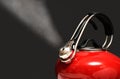 Red Kettle Boiling Isolated on Black Royalty Free Stock Photo