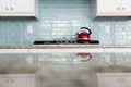 Red Kettle glass backsplash subway tile kitchen Royalty Free Stock Photo