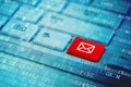 Red key with mail icon symbol on blue digital laptop keyboard Royalty Free Stock Photo