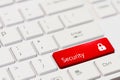 Red key with text Security and closed padlock icon on white laptop keyboard Royalty Free Stock Photo