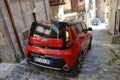 Car going down a narrow steep street in Sicily