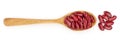 Red kidney bean in wooden spoon isolated on white background. Top view. Flat lay Royalty Free Stock Photo