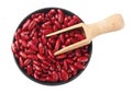 red kidney beans in black bowl with wooden spoon isolated on white background. top view Royalty Free Stock Photo