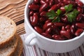 Red kidney beans in a bowl and bread horizontal top view Royalty Free Stock Photo