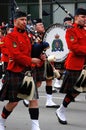 Red Kilted Bagpipe players